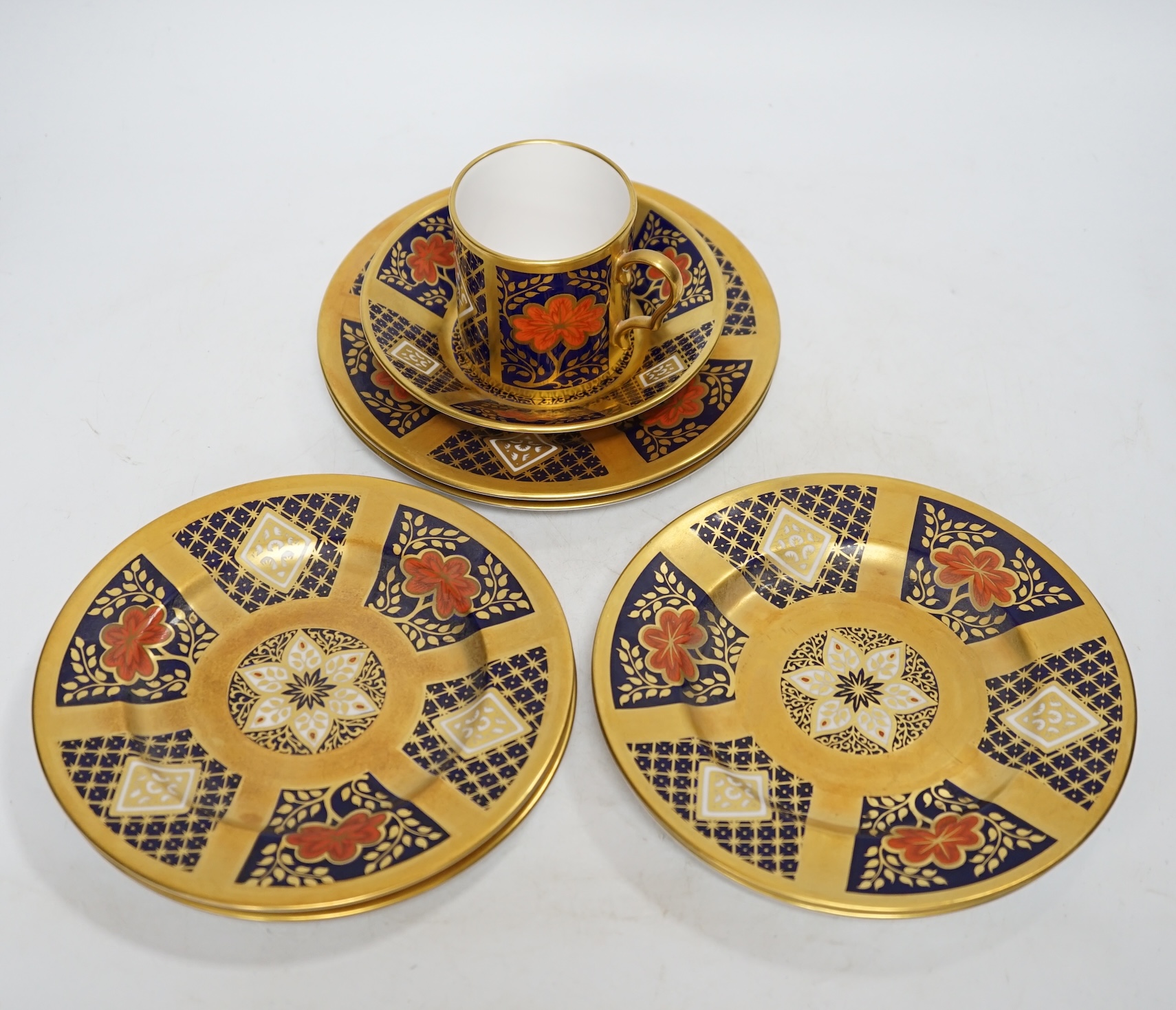 A group of six Caverswall Imari plates, diameter 16cm, and a cup and saucer. Condition - fair to good